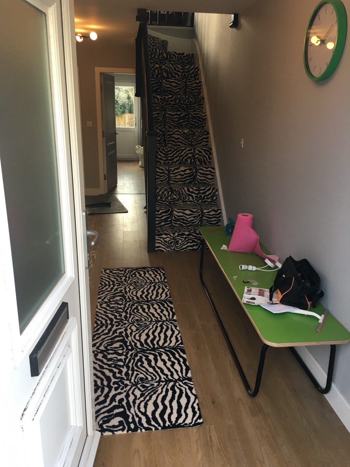 Animal-print carpet on a hallway runner and stairs