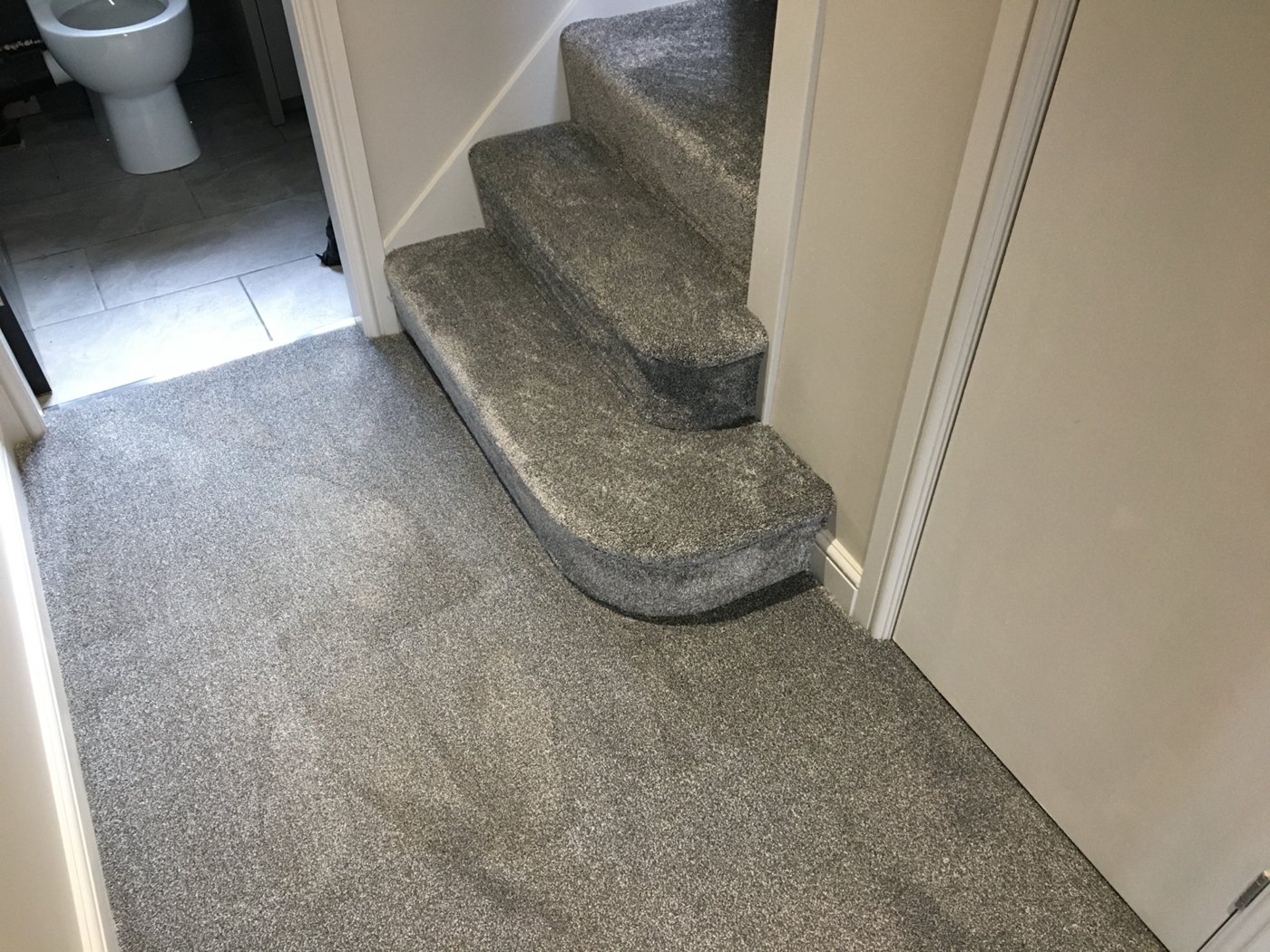 A coordinated grey hallway and staircase